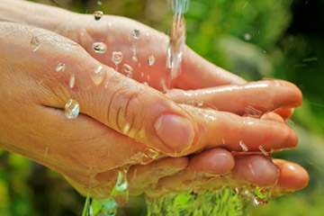 Water flowing over hands